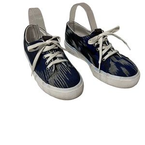 Penelope Chilvers blue and white sneakers